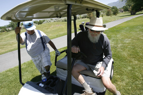 Francisco Kjolseth  |  The Salt Lake Tribune
Ron Powell, left, and Kenton Dale play one of their regular rounds of golf with friends at the Mick Riley Golf Course in Murray on Wednesday, June 29, 2013, where they have been playing for 20 years. The golf course could be facing closure because the Salt Lake City Water Department, which owns most of the property, is increasing the rent to reflect the value of the land, needing that revenue to fund its operations. The county, which operates the course, has negotiated a five-year lease with the city to try to find a permanent solution -- including possible closure.