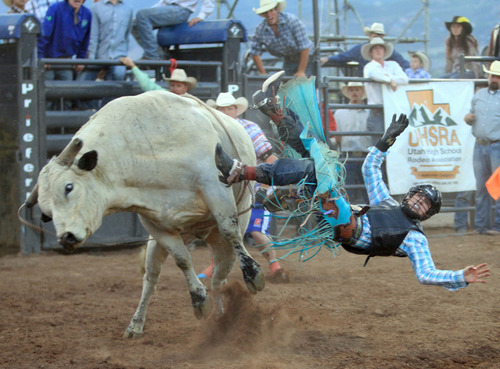 Rick Egan  | The Salt Lake Tribune 

Kyle Balls, Bridgerland, competes in the bull riding finals, during the High school rodeo finals, in Heber City, Saturday, June 15, 2013.