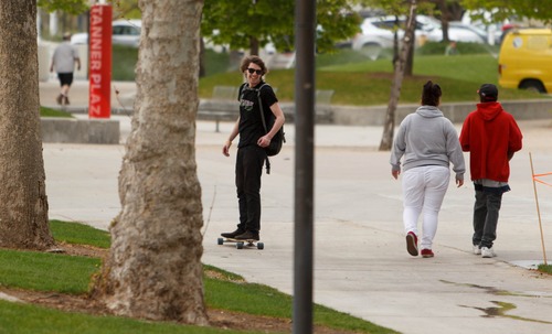 Trent Nelson  |  Tribune file photo
A skateboarder glides through the University of Utah campus in Salt Lake City. A new plan approved Monday would subject skateboarders and bikers to new rules and safety warnings, but wouldn't kick them off campus.