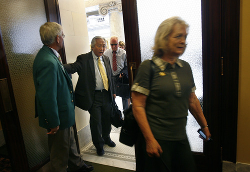 Scott Sommerdorf   |  The Salt Lake Tribune
Rep. Curt Oda, R-Clearfield, enters the hallway leading to the Republican caucus room following Eagle Forum founder Gayle Ruzicka, right, Wednesday, June 19, 2013. Utahns gathered at the Capitol Rotunda in a show of solidarity to protest alleged corruption in the attorney general's office as House Republicans meet to discuss possible impeachment proceedings against John Swallow.