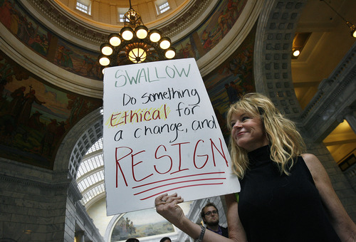 Scott Sommerdorf   |  The Salt Lake Tribune
Nancy Ballard holds a sign with a message for embattled Utah A.G. John Swallow. Utahns will gather at the Capitol Rotunda in a show of solidarity to protest alleged corruption in the attorney general's office as House Republicans meet to discuss possible impeachment proceedings against Swallow, Wednesday, June 19, 2013.
