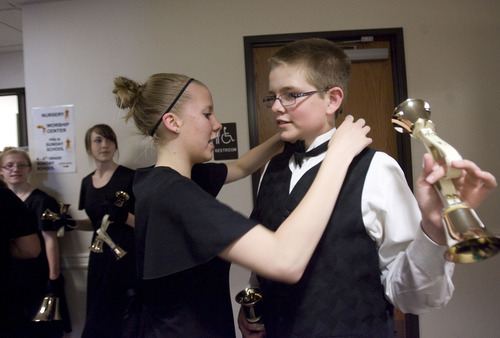 Kim Raff  |  The Salt Lake Tribune
Katherine Knapp (left) helps her brother Corey Knapp fix his bow tie before a dress rehearsal of the Wesley Bell Ringers at Christ United Methodist Church in Salt Lake City on June 9, 2013.  The group celebrates its 50th anniversary this year.