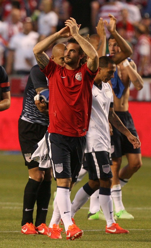 Leah Hogsten  |  The Salt Lake Tribune
Kyle Beckerman (7) of the U.S. celebrates the win with his teammates as they walk the field thanking the sold out crowd. USA defeated Honduras 1-0 at the half during their World Cup soccer qualifying rematch Tuesday, June 18, 2013 at Rio Tinto Stadium.