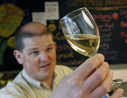 Al Hartmann  |  The Salt Lake Tribune
Jay Yahne checks the color and quality of an apricot-pineapple wine nearly ready at the wine tasting station at the Hive Winery in Layton. He makes 30 kinds of wine. The Hive Winery is one of six Utah wineries which are facing hurdles put up by state lawmakers that make it difficult for them to do business.