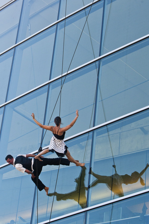 Chris Detrick  |  The Salt Lake Tribune
Vertical dance group Bandaloop members Jessica Swanson and Roel Seeber perform during the Utah Arts Festival at Library Square Thursday June 20, 2013.  The festival continues Friday through Sunday, noon to 11 p.m. each day with tickets costing $12 per day; $6 for people 65 and older; free for kids 12 and under.