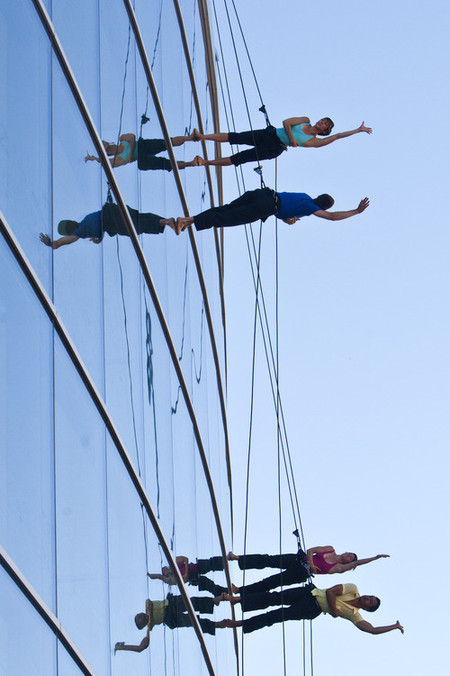 Chris Detrick  |  The Salt Lake Tribune
Vertical dance group Bandaloop members Rachael Lincoln, Andrew Ward, Meghan Merrill, and Melecio Estrella perform during the Utah Arts Festival at Library Square Thursday June 20, 2013.  The festival continues Friday through Sunday, noon to 11 p.m. each day with tickets costing $12 per day; $6 for people 65 and older; free for kids 12 and under.