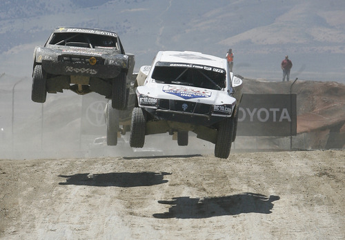 Scott Sommerdorf   |  The Salt Lake Tribune
Carl Renezeder, right, leads Kyle LeDuc on his way to winning his ninth Pro 4 race in a row with a win in today's Pro 4 race at Miller Motorsports Park, Saturday, June 22, 2013.
