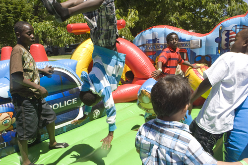 Keith Johnson  |  The Salt Lake Tribune
Children play on one of the inflatable toys during World Refugee Day at Liberty Park in Salt Lake City, June 22, 2013.