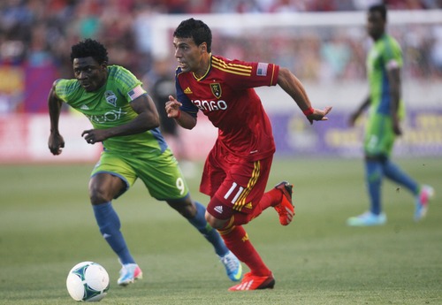 Kim Raff  |  The Salt Lake Tribune
(right) Real Salt Lake midfielder Javier Morales (11) dribbles toward the goal past (left) Seattle Sounders FC forward Obafemi Martins (9) during the first half at Rio Tinto Stadium in Sandy on June 22, 2013. Real went on to win the game 2-0.