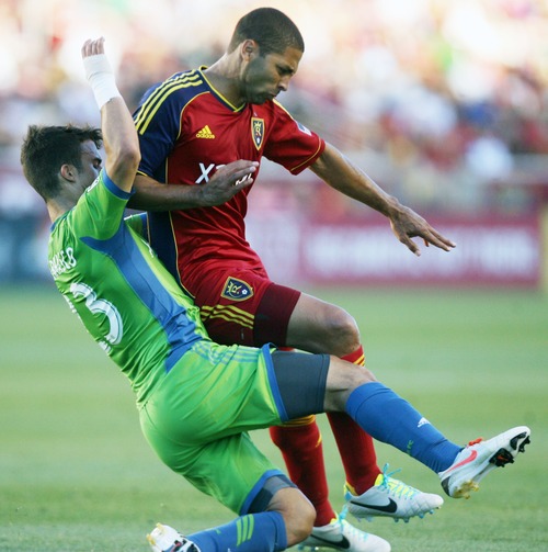 Kim Raff  |  The Salt Lake Tribune
(right) Real Salt Lake forward Alvaro Saborio (15) and (left) Seattle Sounders FC midfielder Servando Carrasco (23) collide during the first half at Rio Tinto Stadium in Sandy on June 22, 2013. Real went on to win the game 2-0.