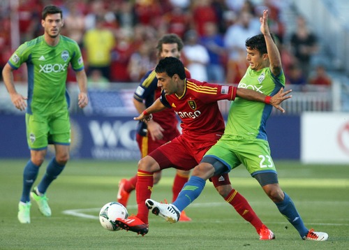 Kim Raff  |  The Salt Lake Tribune
(middle) Real Salt Lake midfielder Javier Morales (11) competes with (right) Seattle Sounders FC midfielder Servando Carrasco (23) for a ball during the first half of a game at Rio Tinto Stadium in Sandy on June 22, 2013.