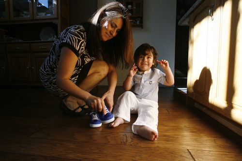Francisco Kjolseth  |  The Salt Lake Tribune
Norma Klemz helps her grandson Micah, 2, with his shoes during a recent visit to their home in Taylorsvile. The potential impact of comprehensive immigration reform will be significant for Norma Klemz of Mexico and her husband of 11 years, Lutheran pastor Steve Klemz. Norma, 45, whose citizenship status is on administrative hold, has been in the country since she was 18 years old and with her husband are the legal guardians of her daughter's child, Micah, 2. She fears deportation and being split from her blended family of seven.