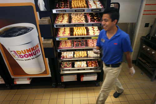 Scott Sommerdorf   |  The Salt Lake Tribune
Trainer Alejandro Montoya patrols the kitchen during a tour of the new Dunkin' Donuts at 217 E. 400 South in Salt Lake City, scheduled to open on Tuesday, June 25.