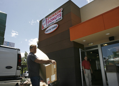 Scott Sommerdorf   |  The Salt Lake Tribune
Display tables and furniture being delivered to Dunkin' Donuts on Wednesday, June 19, 2013, which is opening its first Utah store at 217 E. 400 South in Salt Lake City on Tuesday, June 25.