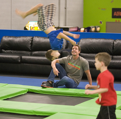Paul Fraughton  |   The Salt Lake Tribune
Chris Steele, who operates The Wairhouse Trampoline Park, watches as Kyle Greeneisen, who turns 12 in August, does a back flip on one of the trampoline jumping areas at the indoor facility.    Tuesday, June 25, 2013