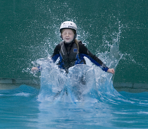 Paul Fraughton  |  The Salt Lake Tribune
Adelaide Herman, age 10, splashes down into the pool at the Utah Winter Sports Park after going off the small aerial ramp. Adelaide was participating in a Tramp and Ramp clinic at the park. Wednesday, June 12, 2013