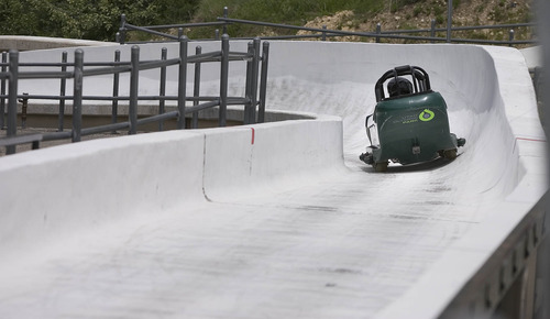 Paul Fraughton  |  The Salt Lake Tribune
Stephen Todd Whitaker goes into the first curve at the start of his bobsled run at the Utah Winter Sports Park. Wednesday, June 12, 2013