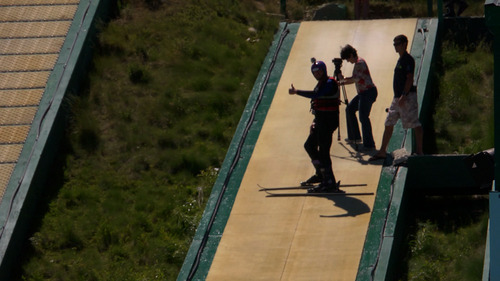 Courtesy KUED |
Salt Lake Tribune writer Brett Prettyman gives a thumbs up as he prepares to ski down the ramp and into the pool while taking part in the "Tramp to Ramp" freestyle ski lessons at Utah Olympic Park in June 2012. The aerial ski lessons and bobsled rides are part of The Utah Bucket List show airing on KUED-Channel 7 in August.
