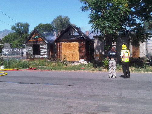 Mike McFall | The Salt Lake Tribune
Firefighters inspect vacant homes on 950 South and 400 West in Salt Lake City that caught fire.