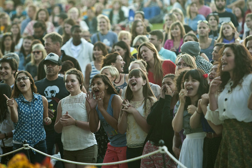 Chris Detrick  |  The Salt Lake Tribune
Fans dance and sing as She & Him, Zooey Deschanel and M. Ward, perform at Red Butte Garden Amphitheatre during the 2013 Outdoor Concert Series Tuesday June 25, 2013.
