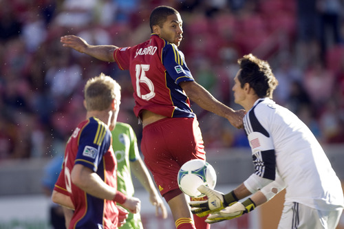 Kim Raff  |  The Salt Lake Tribune
(middle) Real Salt Lake forward Alvaro Saborio (15) heads the ball and (right) Seattle Sounders FC goalkeeper Michael Gspurning (1) makes a save during the first half at Rio Tinto Stadium in Sandy on June 22, 2013.
