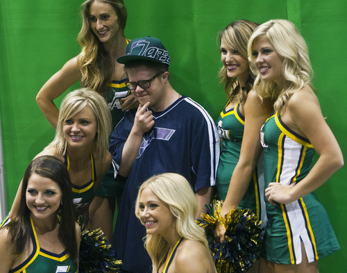Chris Detrick  |  The Salt Lake Tribune
Jazz fan Sam Flygare, 21, of Salt Lake City, poses for a portrait with Utah Jazz dancers during the NBA Draft at EnergySolutions Arena as it is televised live from Barclays Center in Brooklyn, New York Thursday June 27, 2013.