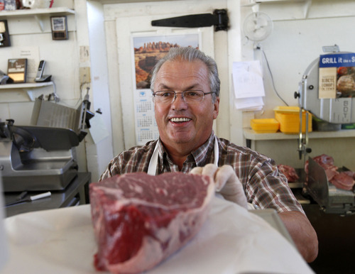 Al Hartmann  |  The Salt Lake Tribune
Butcher Spug Blonquist will cut you a steak for the asking at Summit Merc, a traditional small-town general store that carries everything you need. This store in Coalville is 105 years old and run by the Blonquist family. It has wooden floors, a full grocery section with a white butcher cooler with hand cut meats, hardware section with farm equipment, and work clothes and boots.