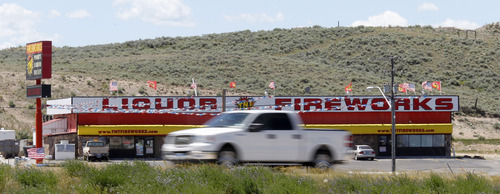 Al Hartmann  |  The Salt Lake Tribune
Traffic along I-80 goes past  large fireworks sellers on the outskirts of Evanston, Wyoming about a mile before the Utah line.