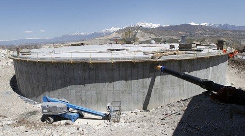 Al Hartmann  |  The Salt Lake 
A 2 million gallon water tank nears completion in Bluffdale on April 24.  The tank will take water from the new National Security Agency facility at Camp Williams and use it as secondary water for Bluffdale's parks.