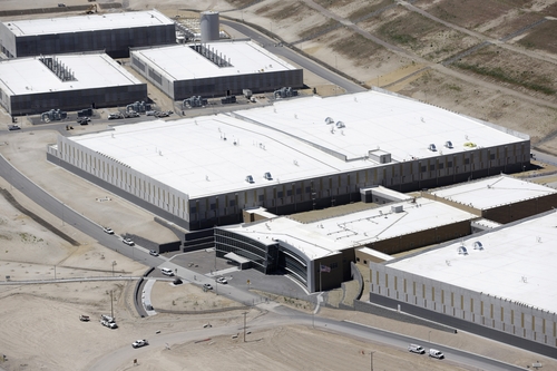 This June 6, 2013 photo shows an aerial view of the NSA's Utah Data Center in Bluffdale, Utah. The nation's new billion-dollar epicenter for fighting global cyberthreats sits just south of Salt Lake City, tucked away on a National Guard base at the foot of snow-capped mountains. The long, squat buildings span 1.5 million square feet, and are filled with super-powered computers designed to store massive amounts of information gathered secretly from phone calls and emails. (AP Photo/Rick Bowmer)