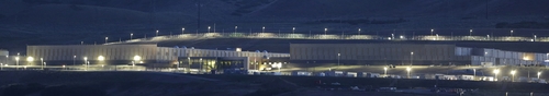 This Monday, June 10, 2013 photo shows a ground level view of Utah's NSA Data Center in Bluffdale, Utah.  The nation's new billion-dollar epicenter for fighting global cyberthreats sits just south of Salt Lake City, tucked away on a National Guard base at the foot of snow-capped mountains. The long, squat buildings span 1.5 million square feet, and are filled with super-powered computers designed to store massive amounts of information gathered secretly from phone calls and emails. (AP Photo/Rick Bowmer)