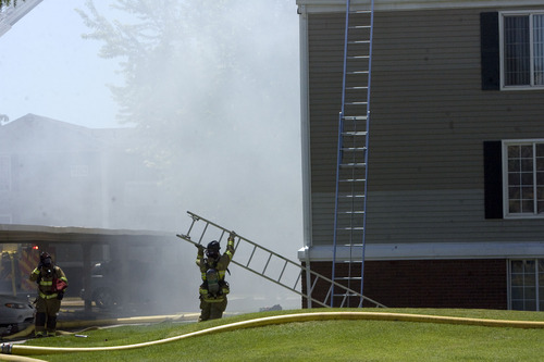 Kim Raff  |  The Salt Lake Tribune
Smoke billows out of an apartment building as Salt Lake City firefighters work to put out a fire at the Park City Apartments off of 900 West in Salt Lake City on June 30, 2013.