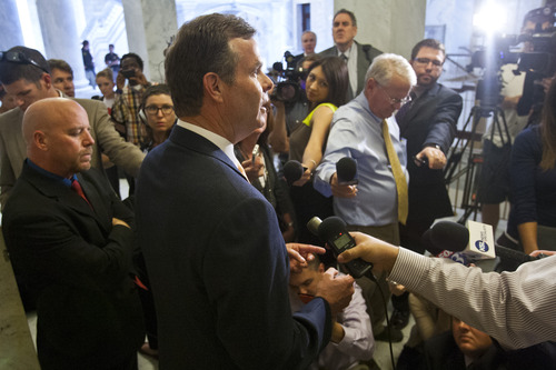 Chris Detrick  |  Tribune file photo
Attorney General John Swallow talks to members of the media outside of his office at the Utah State Capitol on June 19 after the House Republican Caucus voted to create a special committee to investigate allegations against him. Wednesday June 19, 2013.