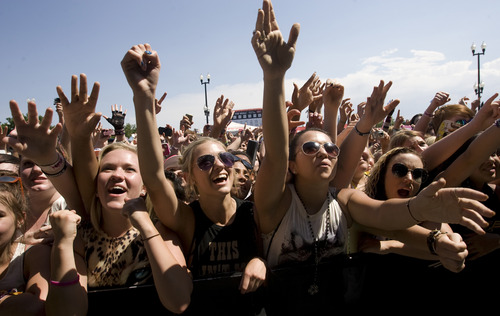 Rick Egan  | The Salt Lake Tribune 

Black Veil Brides cheer as the band takes the stage at the Vans Warped Tour, at the Utah State Fairgrounds, Saturday, June 29, 2013.
