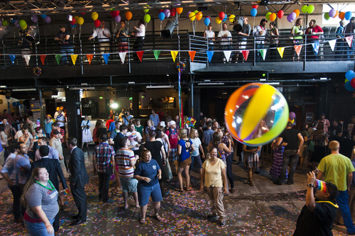 Chris Detrick  |  The Salt Lake Tribune
People dance and hit around a beach ball during a party to show unity, love and celebrate all Utah families at Club Sound Wednesday June 26, 2013.  In historic decisions, the Supreme Court handed gay-rights supporters major victories Wednesday, extending federal rights to same-sex couples and reversing a ban on gay marriage in the nation's largest state.