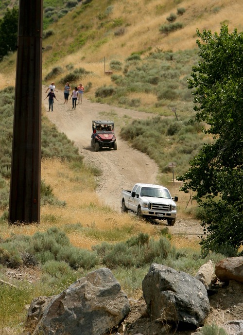 Leah Hogsten  |  The Salt Lake Tribune
Family members of missing hikers Holly Cowsert and her daughter Mandy, 12, and David Cowsert and his two sons, Polo, 13, and Nate 12, of Perry, welcome and follow search and rescue vehicles after they were rescued Wednesday, July 3, 2013 from a rugged Perry Canyon, where they spent the night after becoming lost.