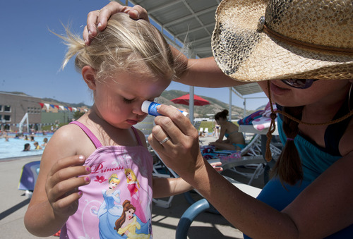 Steve Griffin | The Salt Lake Tribune


Haley Wall uses a sunscreen stick to apply protection to her2-year-old daughter, Elizabeth's, face during an outing at the Salt Lake City Sports Complex on Tuesday, July 2, 2013.