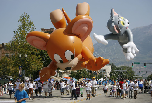 Francisco Kjolseth  |  The Salt Lake Tribune
Tom and Jerry keep up the chase as thousands line the streets of downtown Provo to watch the Freedom Festival Parade on Wednesday, July 4, 2012.