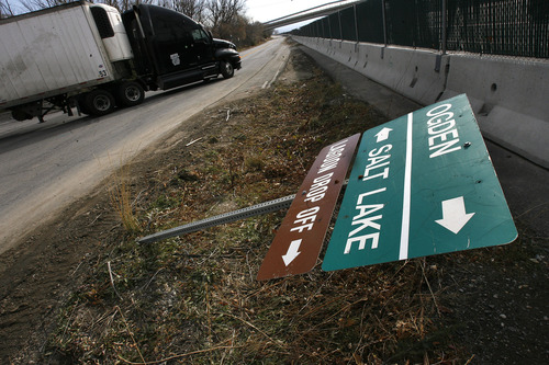 Scott Sommerdorf  |  The Salt Lake Tribune             
Traffic signs were down in various Davis County communities like this one in Farmington as a result of the wind storm, December 2, 2011.