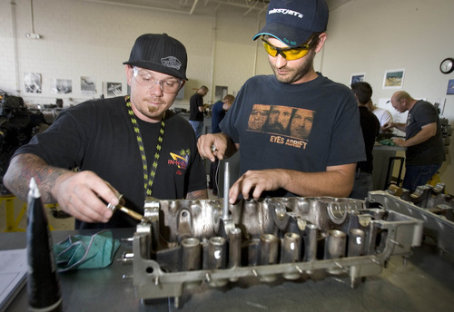 Paul Fraughton  |  The Salt Lake Tribune
Mark Gohner and Mike Whipple, who are taking a course on reciprocating aircraft engines at Salt Lake Community College's  Airport Center, perform work on an engine crank case.