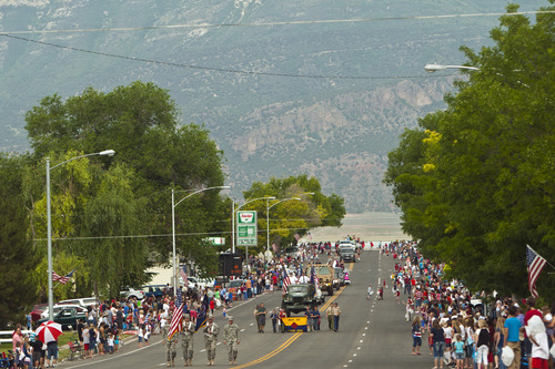 Chris Detrick  |  The Salt Lake Tribune
Crowds of people line Main Street during the 4th of July parade in Moroni Thursday July 4, 2013.