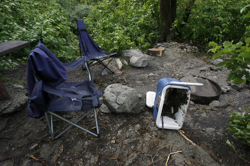 Francisco Kjolseth  |  The Salt Lake Tribune
There is work to be done on the Tanners Flat campground in Little Cottonwood Canyon following a violent rainstorm that sent many fleeing their tents for their cars in the middle of the night. Crews were busy cleaning up a dozen sections of Little Cottonwood Canyon from Tanners Flat campground and below that were blown out by rock debris following the rain storm that started in the early hours on Friday, July 5, 2013.