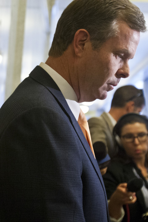 Chris Detrick  |  The Salt Lake Tribune
Attorney General John Swallow talks to members of the media outside of his office at the Utah State Capitol Wednesday June 19, 2013.