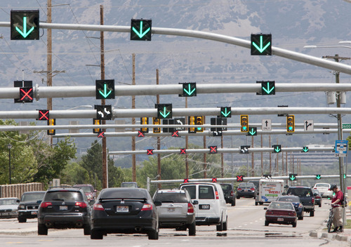 Steve Griffin | The Salt Lake Tribune
Arrows point to the direction of traffic on first-of-their-kind-in-Utah 'flex lanes' on 5400 south in Taylorsville. State highway and police records indicate the experimental reversible lanes are as safe -- perhaps even more safe -- than regular, static lanes.