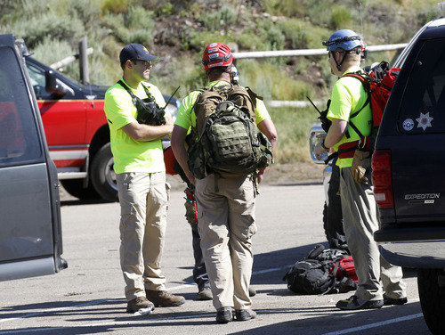 Al Hartmann  |  The Salt Lake Tribune
Utah County search and rescue members stand by at Tibble Fork Reservoir parking lot in American Fork Canyon Monday July 8 to help in the recovery of two injured men whose helicopter crashed and rolled after hitting a hill high up in the mountains near the Utah-Salt Lake County line.  They were able to exrticate themselves from the wreck and use a cell phone to call for help about 8:30 a.m.  An AirMed helicopter with a couple members of the search and rescue members flew to the rugged crash site in the high counry about five miles away.