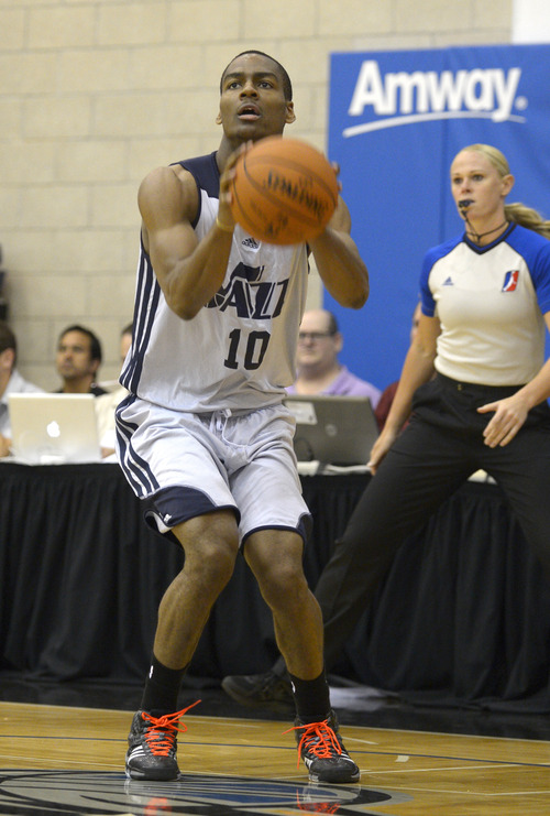 Utah Jazz guard Alec Burks (10) sets up for a shot during the first half of an NBA Orlando Pro Summer League game against the Miami Heat in Orlando, Fla., Sunday, July 7, 2013. (Special to the Tribune/Phelan M. Ebenhack)