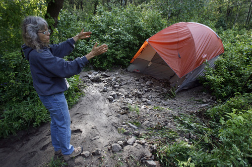 Francisco Kjolseth  |  The Salt Lake Tribune
Camille Allred, of Lindon, describes her harrowing night alongside her husband, Clint, and son Kyle, 16, as their tent started to move in the middle of the night by the force of water and debris. The Allreds alerted authorities about the condition of the road after trying to leave the Tanners Flat campground up Little Cottonwood Canyon at 2:30 a.m. Friday due to the violent rainstorm on Friday.