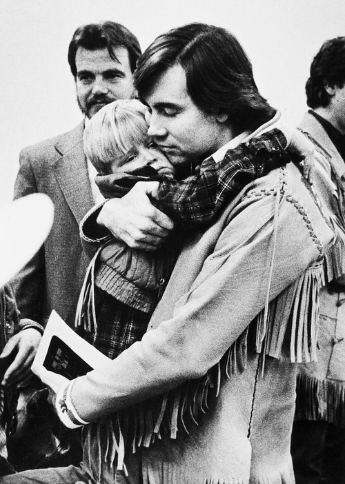 Tribune file photo

Addam Swapp hugs on of his sons during a 1988 court hearing.