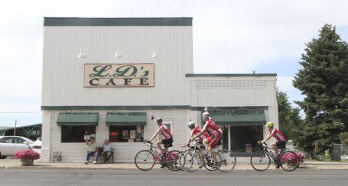 Keith Johnson | The Salt Lake Tribune

Royd VanOrden (left) and Lee Thompson wave to passing cyclists outside L.D.'s Cafe in Richmond, Utah during the MS 150 bike ride through Cache Valley, Utah June 29, 2013.