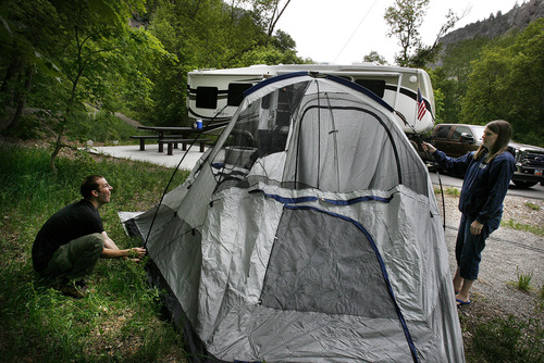 Scott Sommerdorf  |  The Salt Lake Tribune             
Ben and Julie Hunter of West Valley City set up their tent alongside their camper in Little Mill Campground in American Fork Canyon, Thursday afternoon, May 24, 2012.